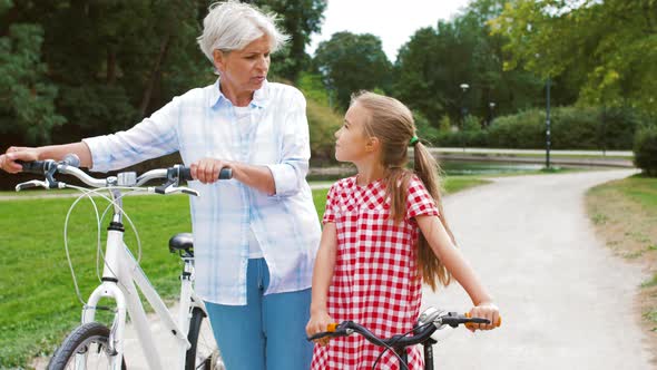 Grandmother and Granddaughter with Bicycles 