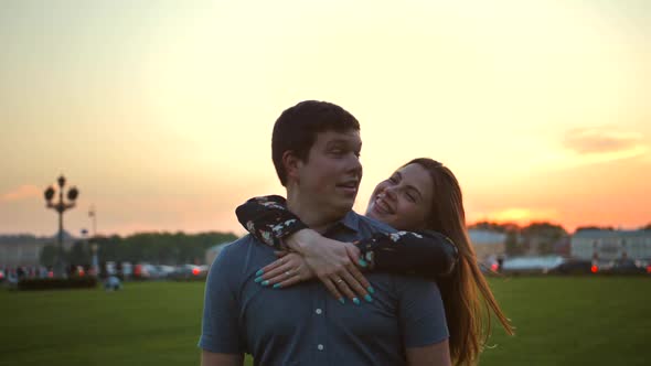 Portrait of a Loving Couple in the Park at Sunset.