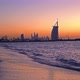 Burj Al Arab in Jumeirah Island or boat building with waves on sea beach, Dubai Downtown - VideoHive Item for Sale