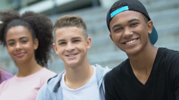 Cheerful Multiethnic Males and Female Smiling on Camera, Friendship and Joy