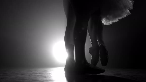 Close Up of Ballet Couple of Dancers As They Practices Exercises on Dark Stage