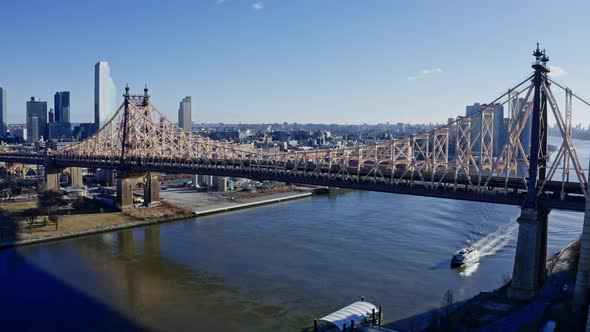 East River Amidst Buildings in City Drone Flying Backward From Skyline