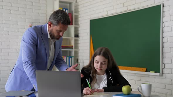 Angry Teacher and Student Study Online with Laptop in Classroom Webinar