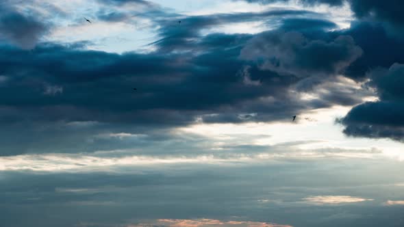 White Fluffy Clouds Slowly Float Through the Blue Daytime Sky Timelapse