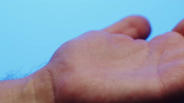 Hand Skin in Blue Neon Light Making Xray of Human Body Part Arm Surface Macro Shooting