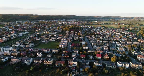 Aerial cityscape of little village in Poland countryside, small residential house district area with