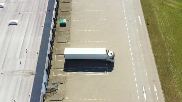 Aerial view of warehouse storages or industrial factory or logistics center from above. Aerial view