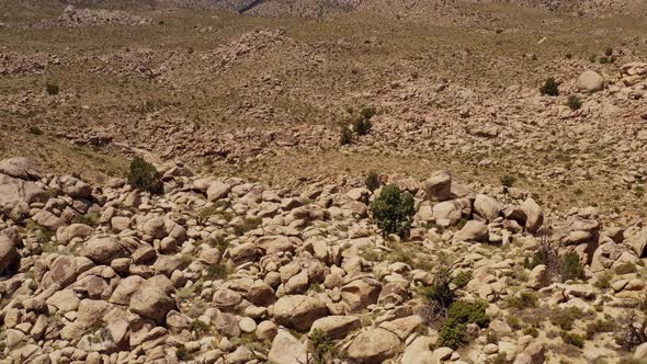 Aerial shot of interesting rock formations in the desert of California