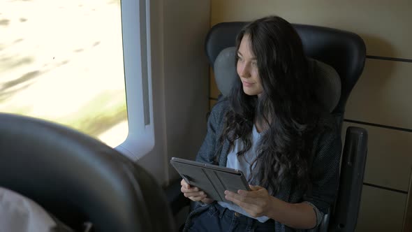 Woman With Tablet in Train