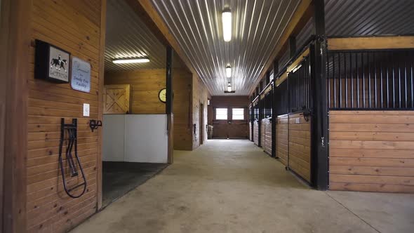 Interior of a wooden stable on a farm.