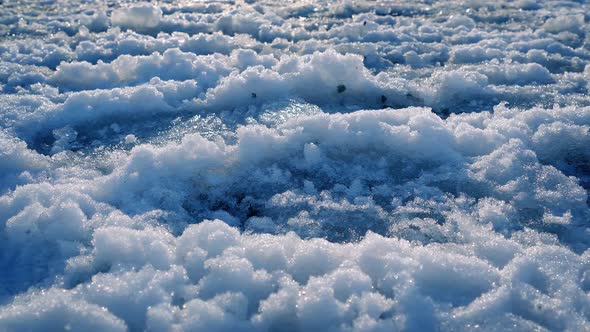 Moving Past Snowy Path With Footprints