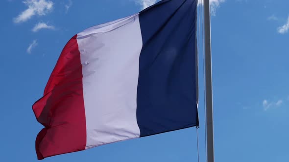 The french national flag waving in the wind.