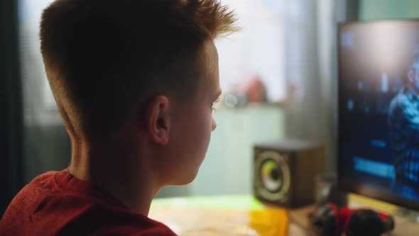 Teenager Speaking with Teacher During Online Lesson