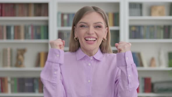 Portrait of Excited Woman Celebrating Success