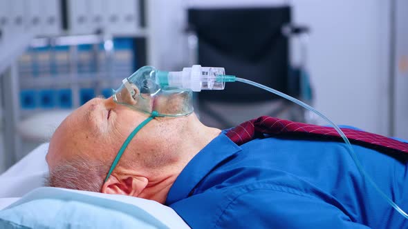 Portrait of Old Male Patient Weating Oxygen Mask