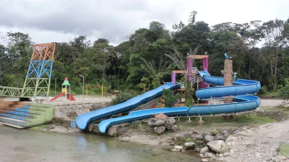 Zooming in at a waterslide in a tourist theme park