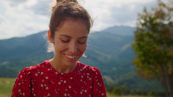 Closeup Smiling Woman Posing in Front Mountains