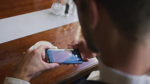 Young professional man in a cafe