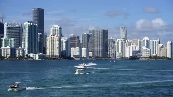 View at Miami's Embankment and Sailing Boats on Blue Sky Background