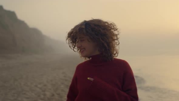 Excited Girl Jumping on Beach