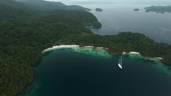 Triton Bay: Boat On Turquoise Sea And Green Tropical Trees In Kaimana Islands