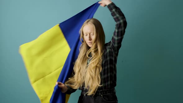 Young Woman with Ukrainian Flag During the War