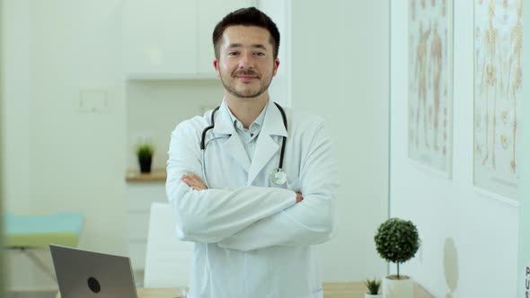 Young Man Doctor Wear White Medical Uniform and Stethoscope Looking at Camera Male Professional