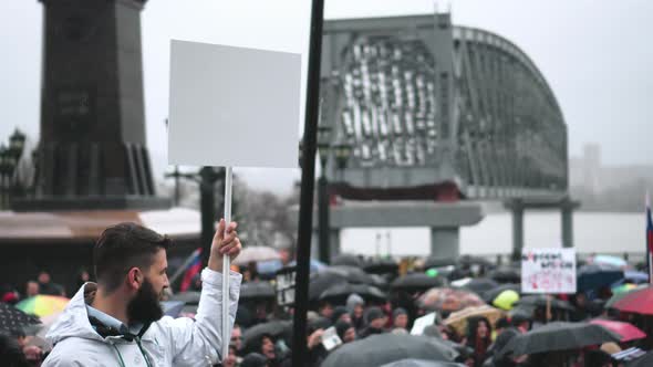 Protest Person Holds Empty Banner for Advertisement