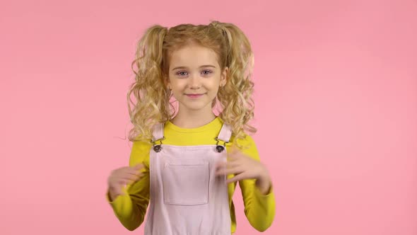 Lovely Blond Curly Girl Is Clapping Her Hands
