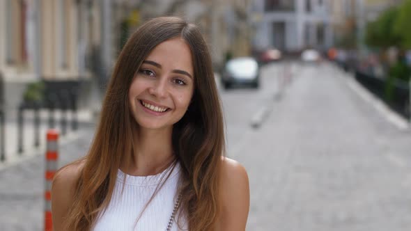 Portrait of Lovely Caucasian Girl Smiling Outdoors