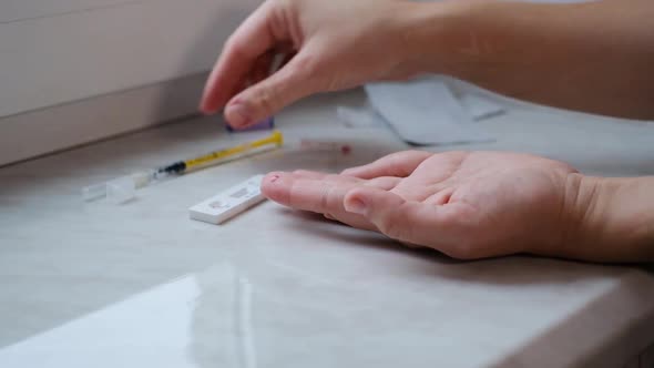 A woman doing a rapid test at home to determine the coronavirus, COVID 19