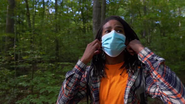 Black Man Takes Off Face Mask While Escaping Quarantine in Forest