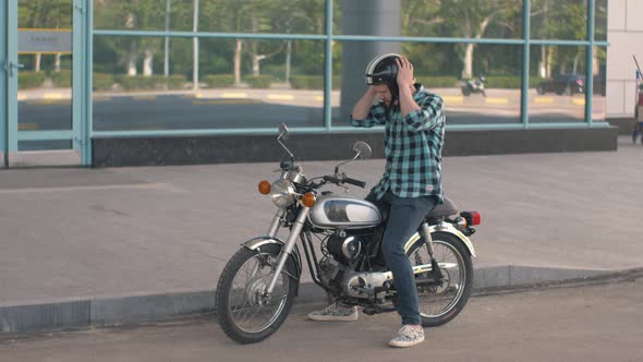 Young Man Riding Custom Motorcycle on Street Road Slow Motion