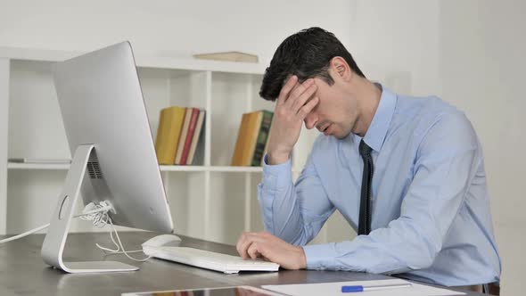 Headache Tired Businessman Working on Computer