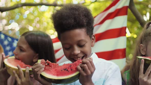 Boy with Friends Eating Watermelon