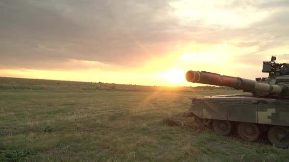 Cinematic Shot of Real Military Tank Firing the Sun