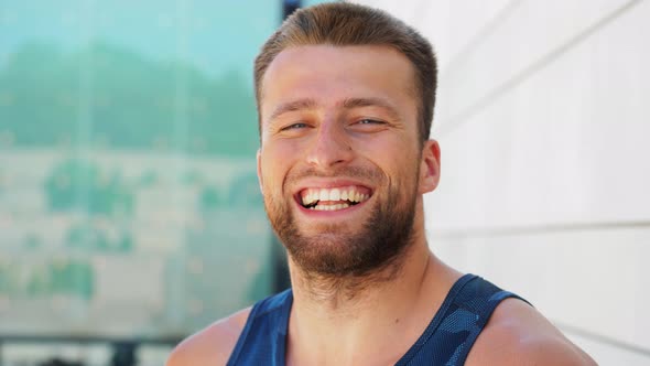 Portrait of Happy Smiling Young Man Outdoors