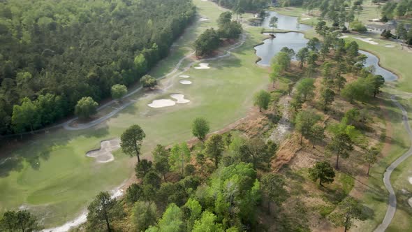 Aerial high above Magnolia Greens Gold course