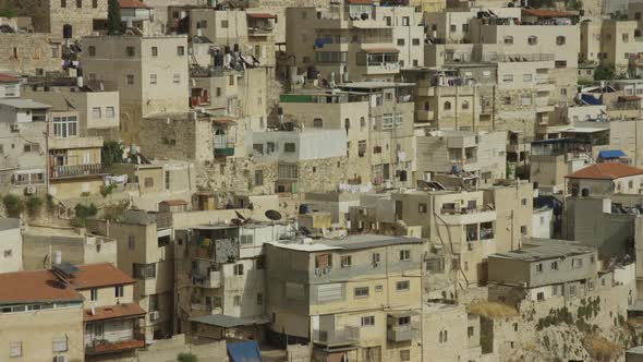 Pan right view of stone buildings