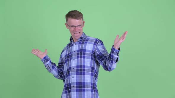 Portrait of Happy Hipster Man Looking Surprised