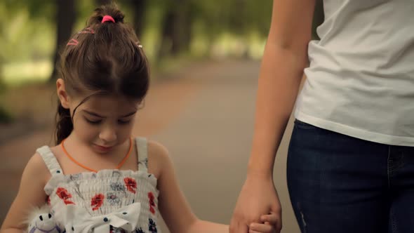 Mother's Day. Little Girl Holding Mother Hand. Cute Adorable Kid Enjoy Together With Family.