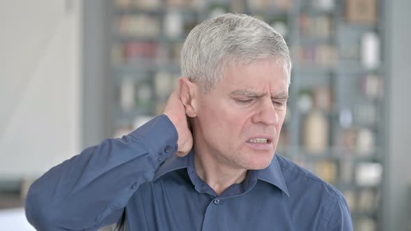 Portrait of Tired Middle Aged Man Having Neck Pain