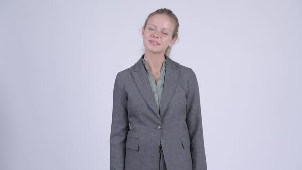 Young Happy Blonde Businesswoman Relaxing with Eyes Closed