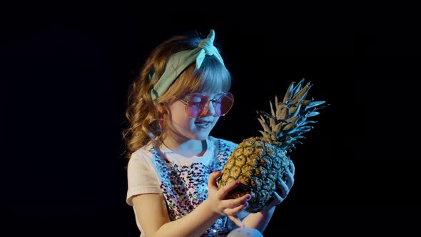 Trendy Stylish Girl in Sunglasses with Pineapple Singing Fooling Around at Disco Cyberpunk Club