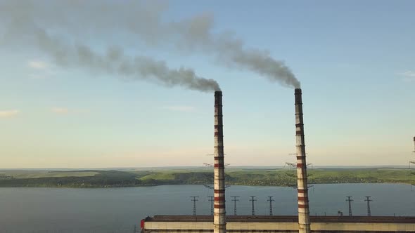 Aerial view of tall chimney pipes with gray dirty smoke from coal power plant, Production 