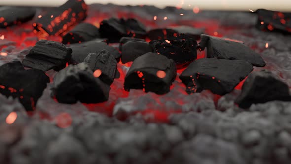 Close-up Of Glowing Embers And Charcoals With Flying Sparks