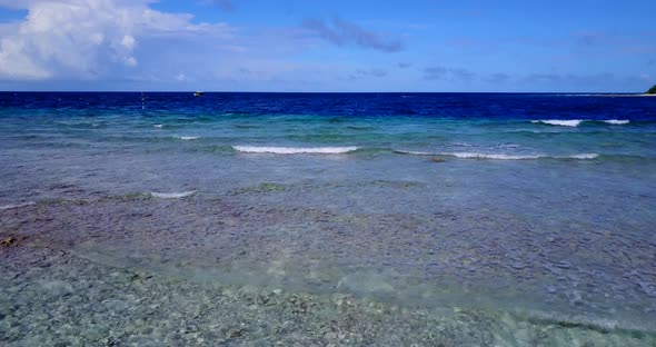 Tropical drone abstract shot of a paradise sunny white sand beach and aqua turquoise water background