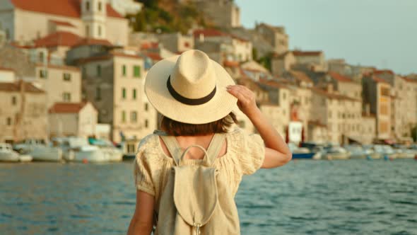 Happy woman looking at the sea on vacation, video 6k