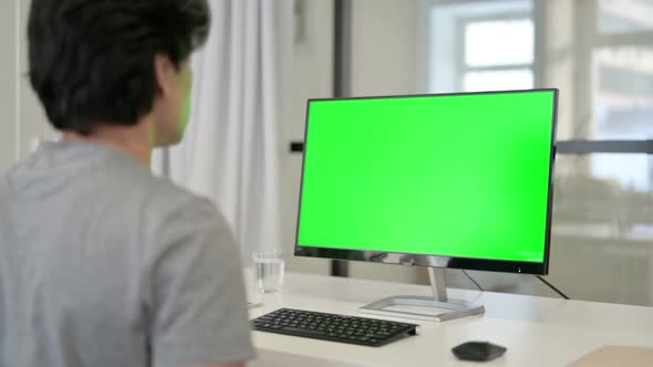 Video Call By Businessman on Desktop with Green Chroma Key Screen