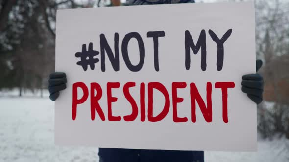 Single picket. Not my president. Protest against the newly elected president.